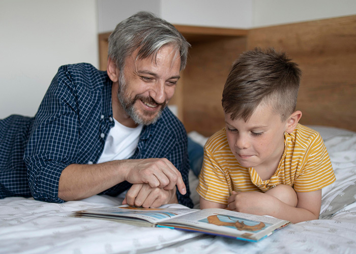 father reading son