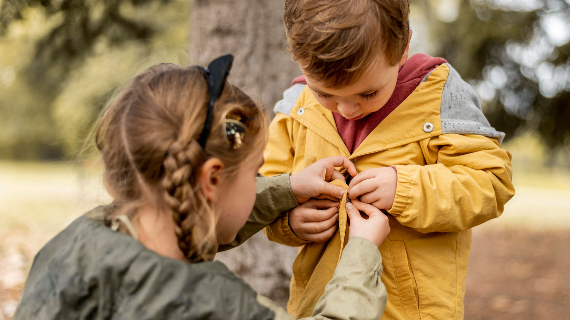 What is Social Emotional Learning and Why It Matters for Kids Ages 1 to 9 girl helping boy